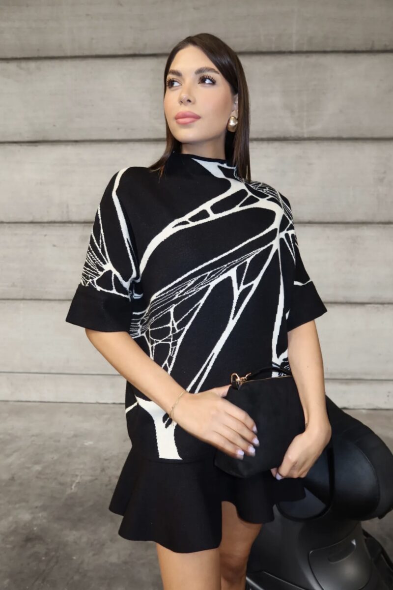 Pull en maille noir à motifs blanc